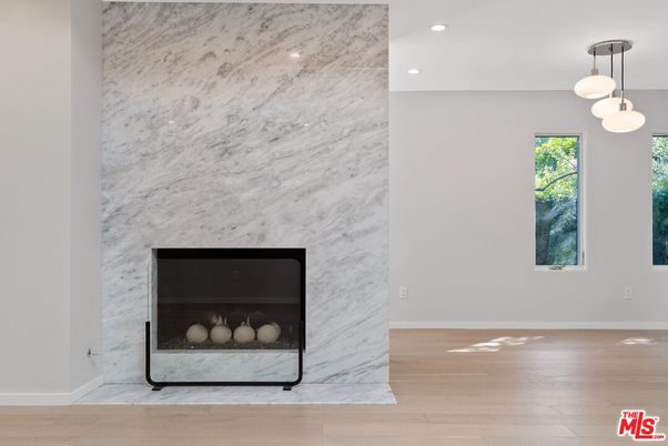 Fireplace, Interior, Marble Walls, Pendant Lights, Recessed Lighting, Wood Texture Flooring