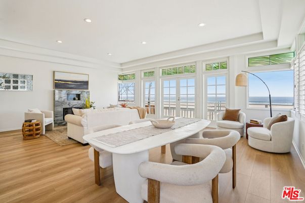 Dining room, Fireplace, Interior, Living room, Recessed Lighting, Water, Wood Texture Flooring