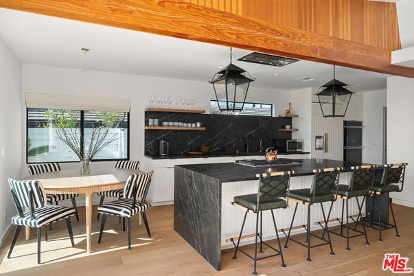 Dining room, Interior, Kitchen, Marble Walls, Pendant Lights, Stainless Steel Appliances, Wood Texture Flooring