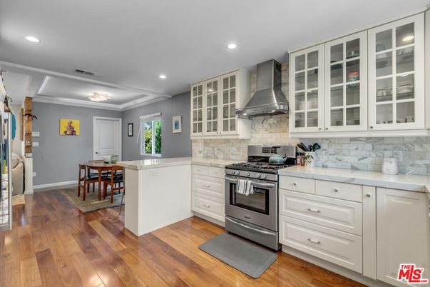Dining room, Interior, Kitchen, Recessed Lighting, Stainless Steel Appliances, Wood Texture Flooring