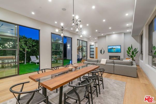 Dining room, Fireplace, Interior, Living room, Pendant Lights, Recessed Lighting, Wood Texture Flooring