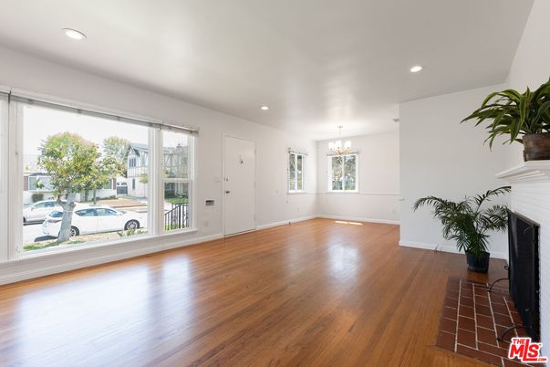 Chandelier, Empty room, Fireplace, Interior, Recessed Lighting, Wood Texture Flooring