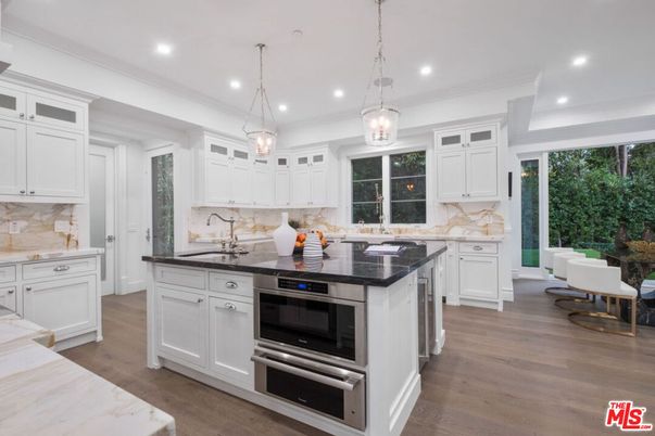 Interior, Kitchen, Marble Walls, Pendant Lights, Recessed Lighting, Stainless Steel Appliances, Wood Texture Flooring