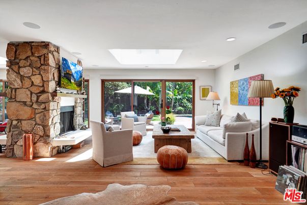 Fireplace, Interior, Living room, Recessed Lighting, Stone Walls, Wood Texture Flooring