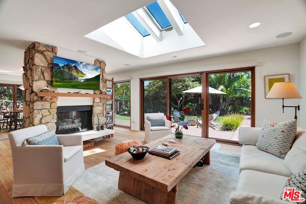 Fireplace, Glass Ceilings, Interior, Living room, Recessed Lighting, Stone Walls, Wood Texture Flooring