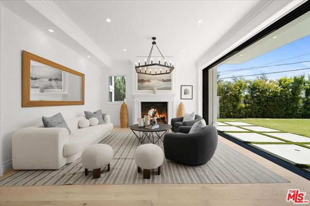 Chandelier, Fireplace, Interior, Living room, Pendant Lights, Recessed Lighting, Wood Texture Flooring