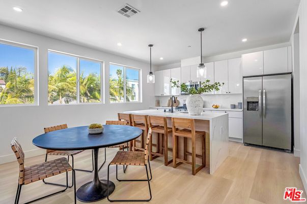 Dining room, Interior, Kitchen, Pendant Lights, Recessed Lighting, Stainless Steel Appliances, Wood Texture Flooring