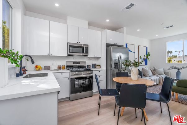 Dining room, Interior, Kitchen, Recessed Lighting, Stainless Steel Appliances, Wood Texture Flooring