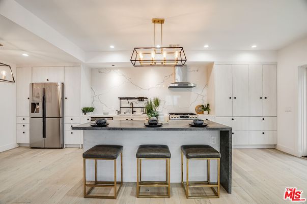 Interior, Kitchen, Marble Walls, Pendant Lights, Recessed Lighting, Stainless Steel Appliances, Wood Texture Flooring