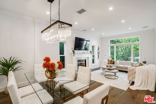 Chandelier, Dining room, Fireplace, Interior, Living room, Recessed Lighting, Wood Texture Flooring