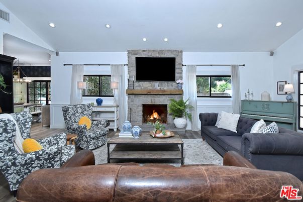 Fireplace, Interior, Living room, Pendant Lights, Recessed Lighting, Stone Walls, Wood Texture Flooring