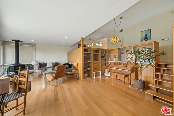 Chandelier, Fireplace, Interior, Living room, Pendant Lights, Piano, Recessed Lighting, Wood Texture Flooring