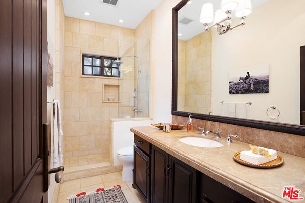 Bathroom, Dual Sink Vanities, Glass Shower, Interior, Recessed Lighting, Stone Walls