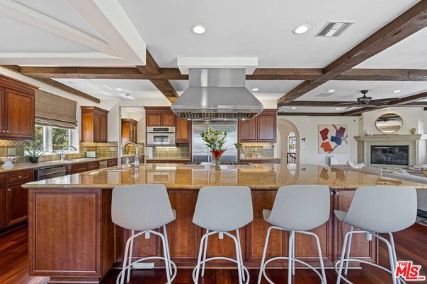 Fireplace, Interior, Kitchen, Recessed Lighting, Stainless Steel Appliances, Wooden Beams, Wood Texture Flooring