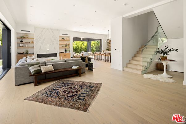 Dining room, Fireplace, Interior, Living room, Marble Walls, Pendant Lights, Recessed Lighting, Wood Texture Flooring