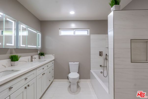 Bathroom, Dual Sink Vanities, Glass Shower, Interior, Marble Walls, Recessed Lighting