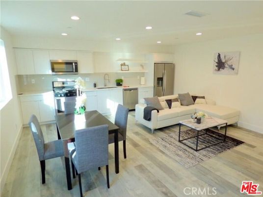 Dining room, Interior, Kitchen, Living room, Recessed Lighting, Stainless Steel Appliances, Wood Texture Flooring