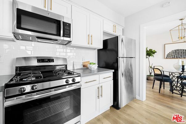Dining room, Interior, Kitchen, Pendant Lights, Stainless Steel Appliances, Wood Texture Flooring