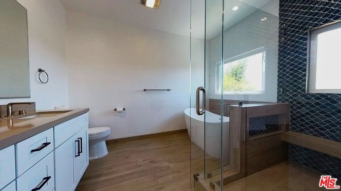 Bathroom, Dual Sink Vanities, Glass Shower, Interior, Recessed Lighting, Wood Texture Flooring