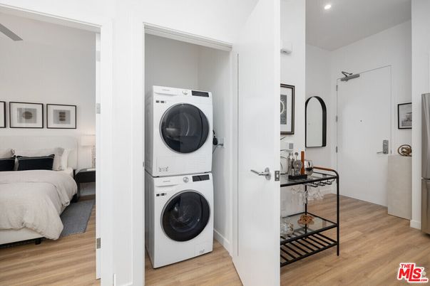 Bedroom, Interior, Recessed Lighting, Utility Closets, Washer, Wood Texture Flooring