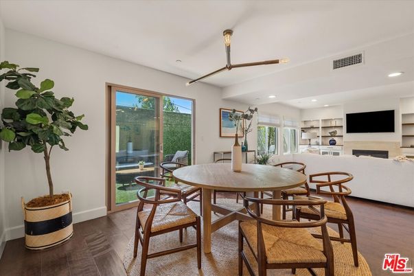 Dining room, Fireplace, Interior, Living room, Recessed Lighting, Wood Texture Flooring