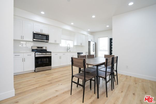 Dining room, Interior, Kitchen, Recessed Lighting, Stainless Steel Appliances, Wood Texture Flooring