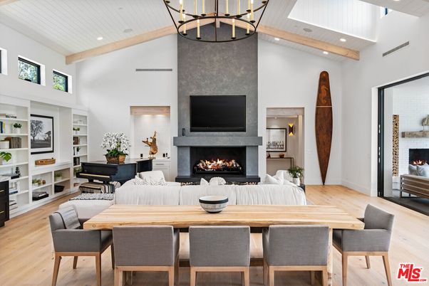 Chandelier, Dining room, Fireplace, Interior, Living room, Pendant Lights, Piano, Recessed Lighting, Wooden Beams, Wood Texture Flooring