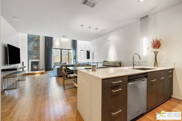 Dining room, Fireplace, Interior, Kitchen, Living room, Pendant Lights, Recessed Lighting, Stainless Steel Appliances, Wood Texture Flooring