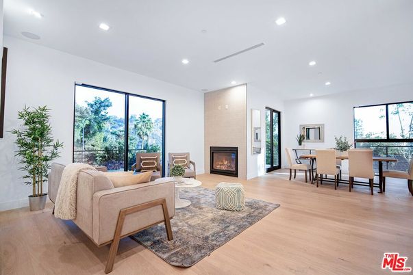Dining room, Fireplace, Interior, Living room, Recessed Lighting, Wood Texture Flooring