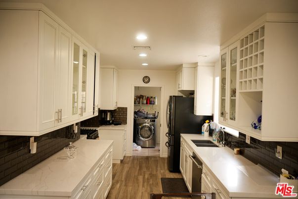 Interior, Kitchen, Recessed Lighting, Washer, Wood Texture Flooring