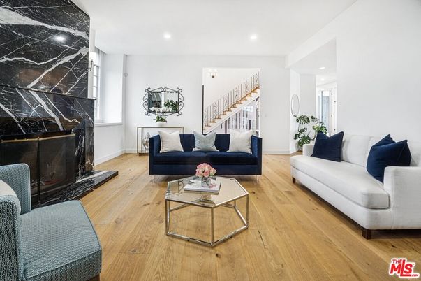 Fireplace, Interior, Living room, Marble Walls, Recessed Lighting, Wood Texture Flooring