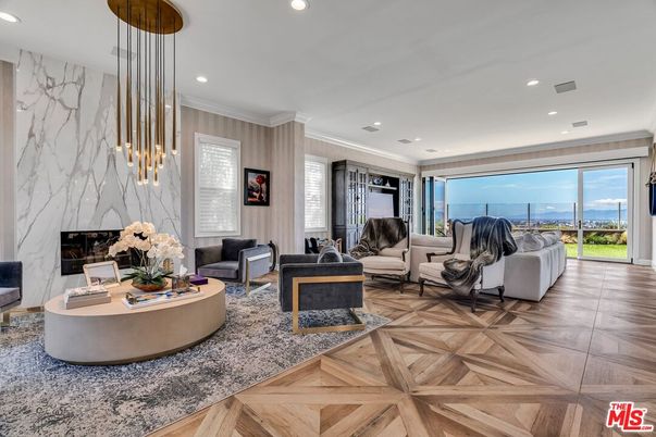 Fireplace, Interior, Living room, Marble Walls, Pendant Lights, Recessed Lighting, Wood Texture Flooring