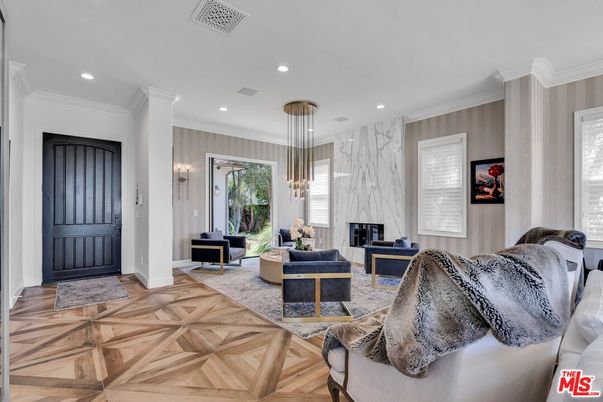 Fireplace, Interior, Living room, Marble Walls, Pendant Lights, Recessed Lighting, Wood Texture Flooring
