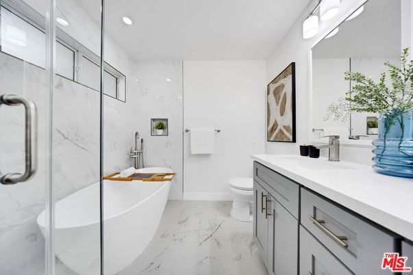 Bathroom, Dual Sink Vanities, Free Standing Baths, Glass Shower, Interior, Marble, Marble Walls, Recessed Lighting