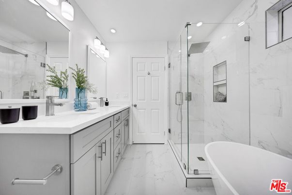 Bathroom, Dual Sink Vanities, Free Standing Baths, Glass Shower, Interior, Marble, Marble Walls, Recessed Lighting