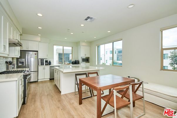 Dining room, Interior, Kitchen, Recessed Lighting, Stainless Steel Appliances, Wood Texture Flooring