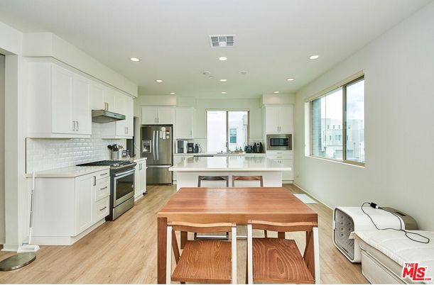 Dining room, Interior, Kitchen, Recessed Lighting, Stainless Steel Appliances, Wood Texture Flooring