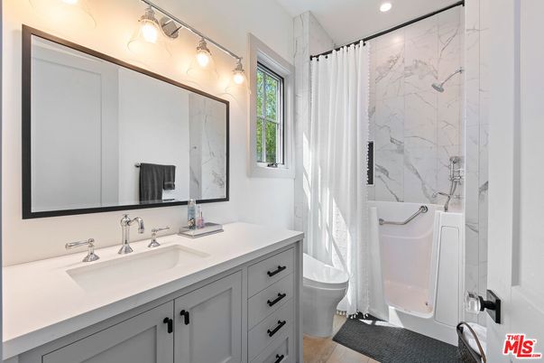 Bathroom, Dual Sink Vanities, Interior, Marble Walls, Recessed Lighting