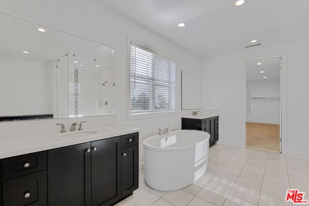 Bathroom, Dual Sink Vanities, Free Standing Baths, Glass Shower, Interior, Recessed Lighting, Wood Texture Flooring
