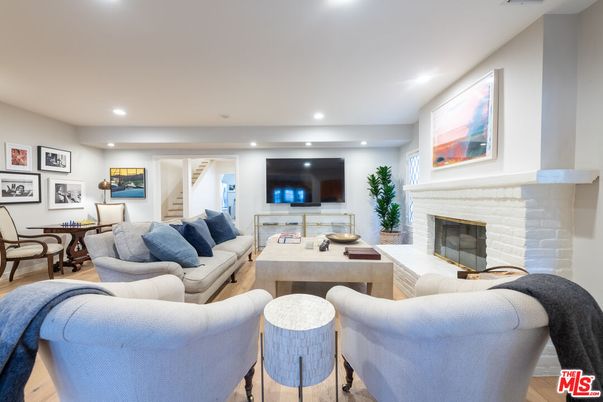 Dining room, Fireplace, Interior, Living room, Recessed Lighting, Wood Texture Flooring