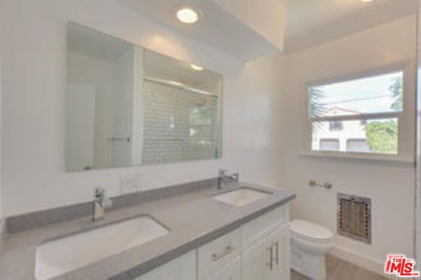 Bathroom, Dual Sink Vanities, Glass Shower, Interior, Recessed Lighting, Wood Texture Flooring