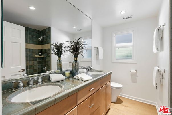 Bathroom, Dual Sink Vanities, Interior, Recessed Lighting, Tile Countertops, Wood Texture Flooring