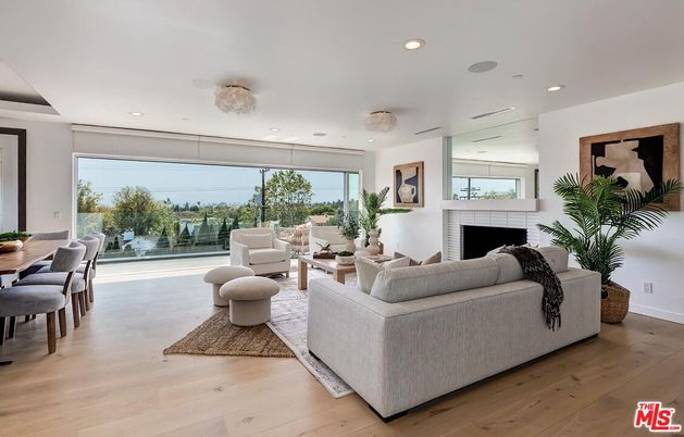 Dining room, Fireplace, Interior, Living room, Recessed Lighting, Wood Texture Flooring
