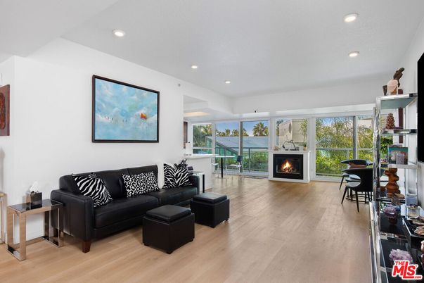 Dining room, Fireplace, Interior, Living room, Recessed Lighting, Water, Wood Texture Flooring