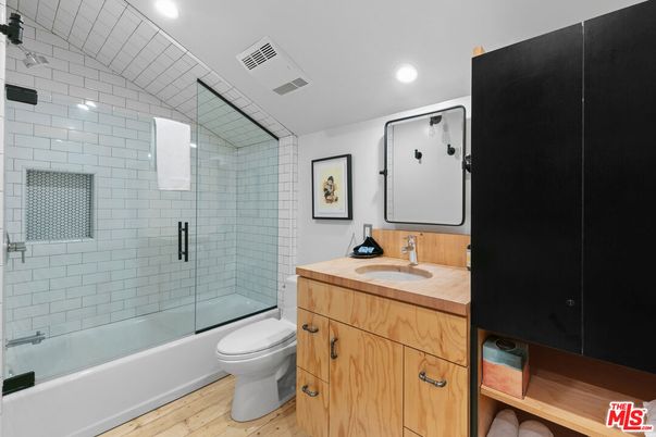 Bathroom, Glass Shower, Interior, Recessed Lighting, Tile Countertops, Wood Texture Flooring