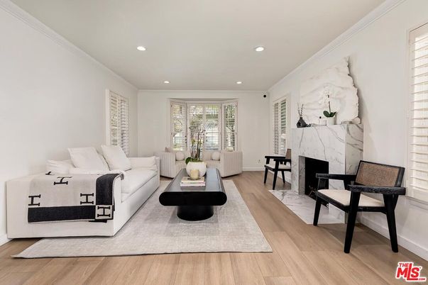 Fireplace, Interior, Living room, Marble Walls, Recessed Lighting, Wood Texture Flooring