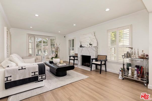 Fireplace, Interior, Living room, Marble Walls, Recessed Lighting, Wood Texture Flooring