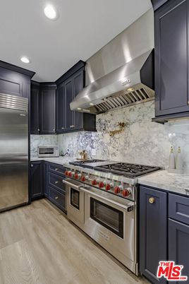 Interior, Kitchen, Marble Walls, Recessed Lighting, Stainless Steel Appliances, Wood Texture Flooring