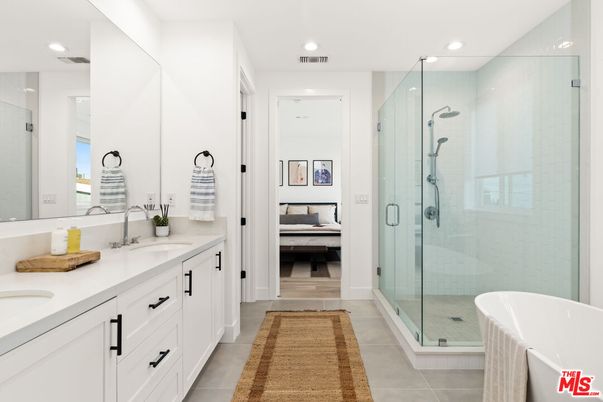 Bathroom, Bedroom, Dual Sink Vanities, Free Standing Baths, Glass Shower, Interior, Recessed Lighting, Wood Texture Flooring