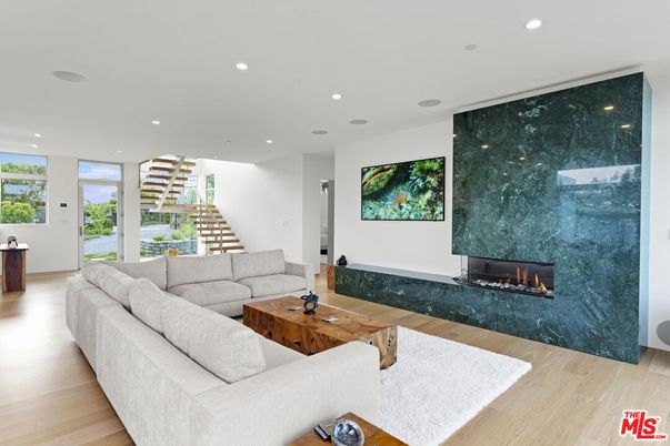 Fireplace, Interior, Living room, Marble Walls, Recessed Lighting, Wood Texture Flooring